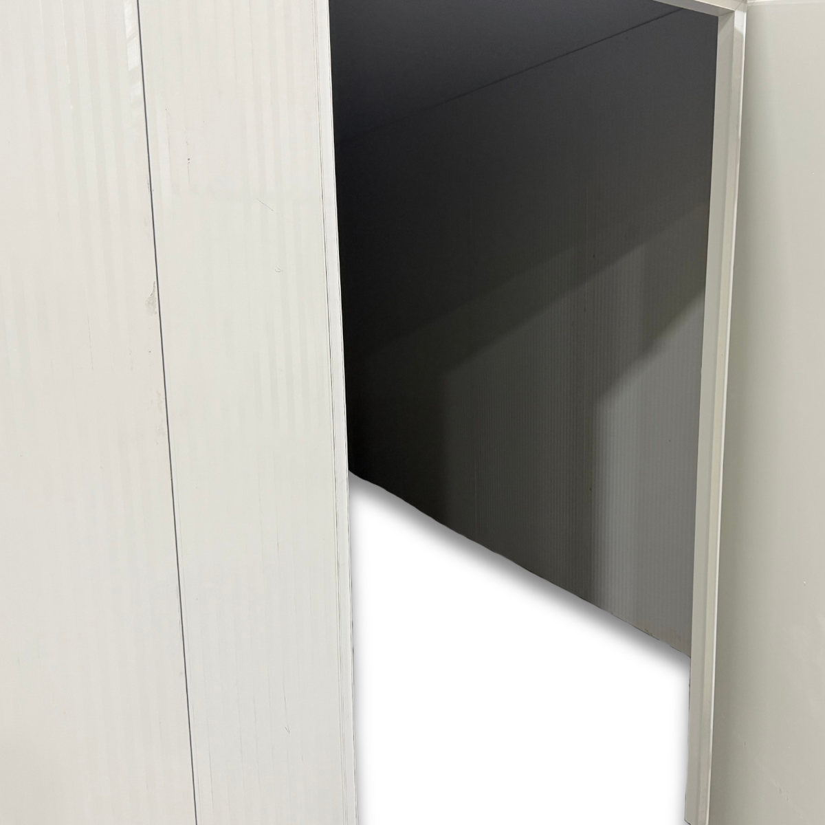 Barr 8'3" x 27'11" x 8'H Walk-In Cold Room without Floor — supplier gallery view 5; White walk-in cooler unit with closed hinged door, featuring insulated panel walls inside view