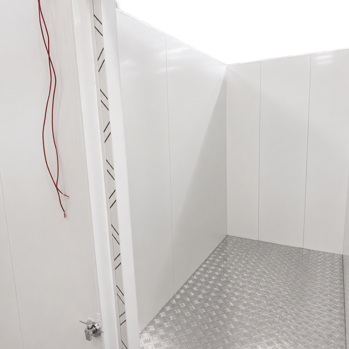Barr 8'3" x 9'10" x 8'2"H Walk-In Cold Room with Floor — supplier gallery view 3; White walk-in cooler with insulated panels and floor, including ceiling panels stacked nearby inside view