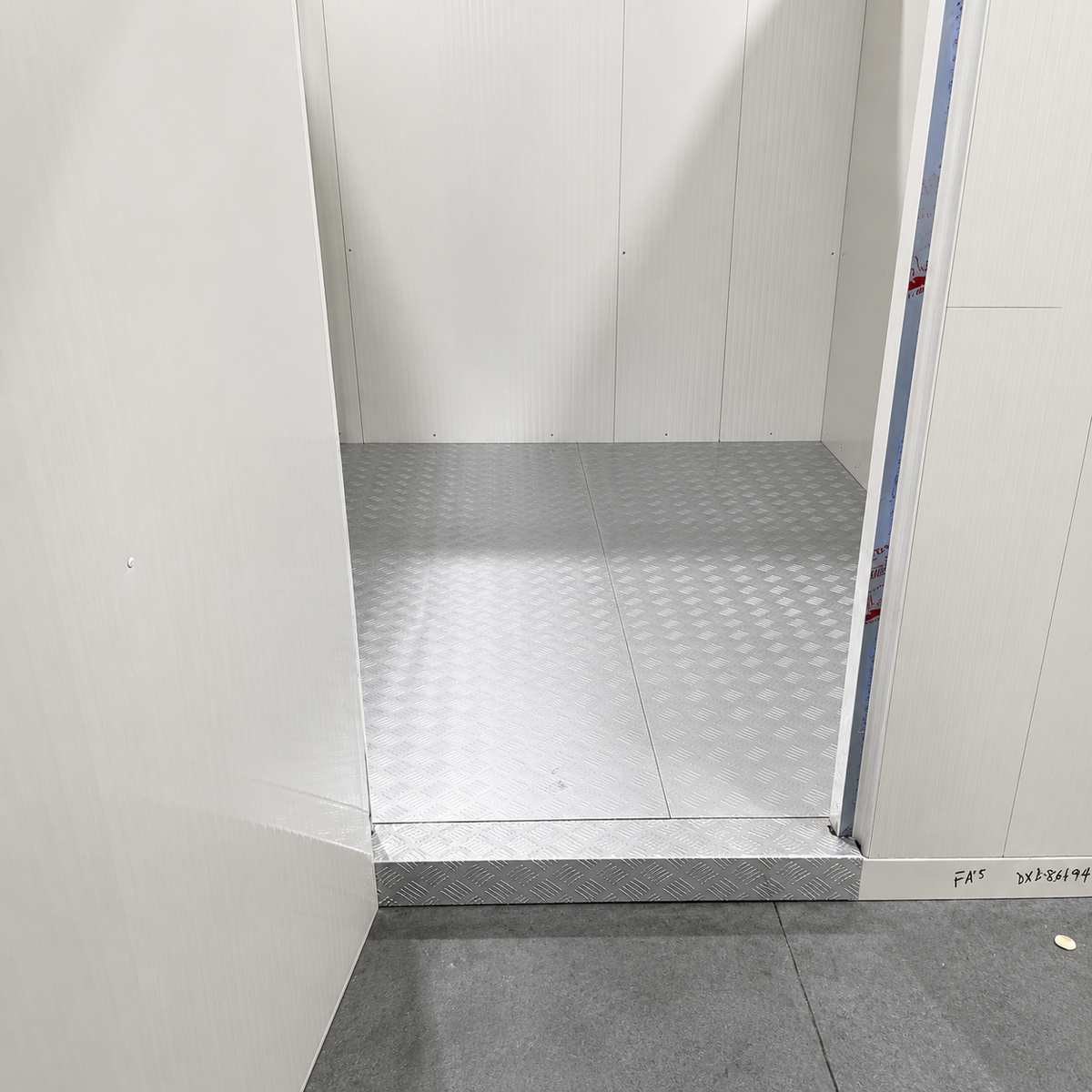 Barr 9'10" x 19'8" x 8'2"H Walk-In Cooler-Freezer Combo with Floor — supplier gallery view 3; Inside view of a white walk-in combo cooler-freezer with two doors and stainless hardware