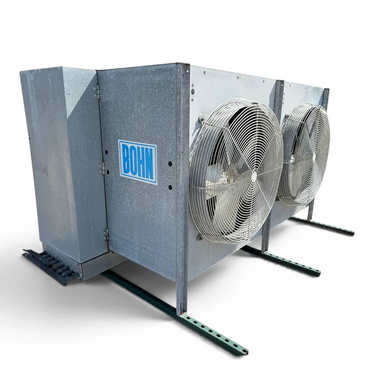 Used Bohn PG-2502D Evaporator — supplier gallery view 1; Front-left view of a used Bohn PG-2502D evaporator #3045, a gray penthouse-style fan coil unit with two large round wire-grille fans and green support legs.