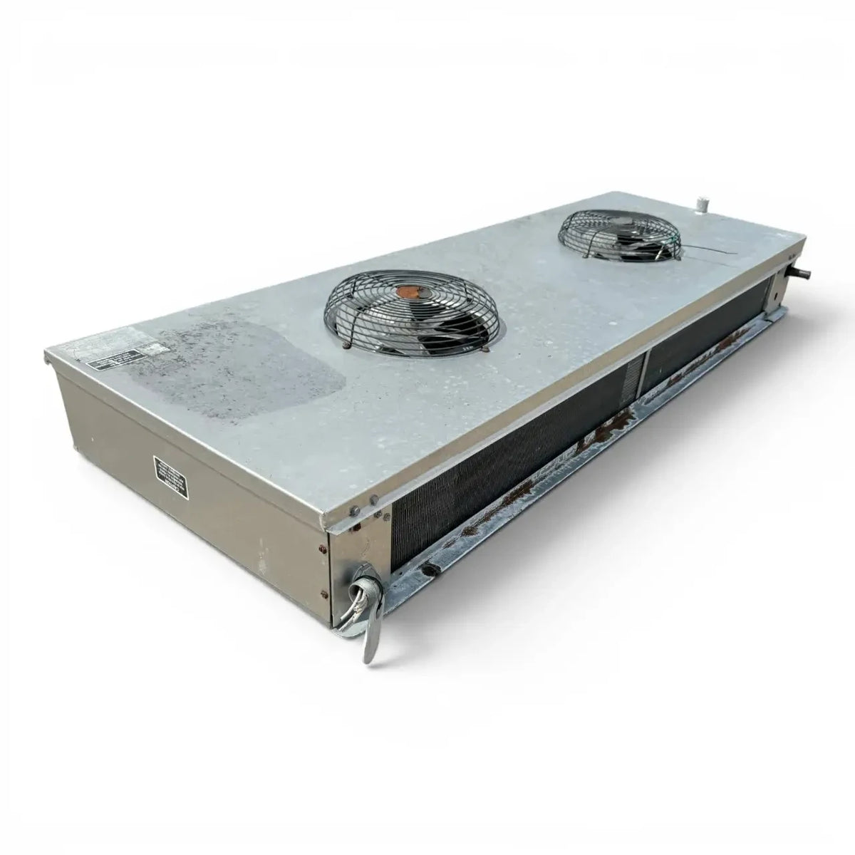 Used Tyler EFE-100MD Low Velocity Evaporator #673 — supplier gallery view 3; Front-left view of a used Tyler EFE-100MD low velocity evaporator #673, a gray fan coil unit with two round black-grille fans.