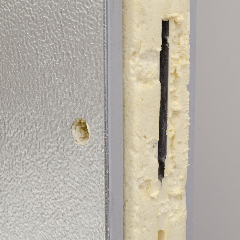 Norlake FTOB8788-CX-M Fast Trak 8' x 8' x 8' 7" Outdoor Walk-In Cooler — supplier gallery view 9; The metal door of a Norlake Kold Locker.