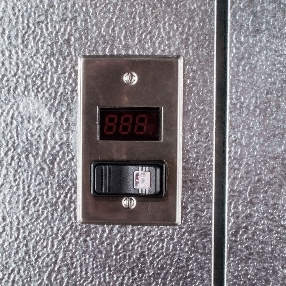 NorlakeFTB8466-CX-M Fast Trak 6' x 6' x 8' 4" Floorless Indoor Walk-In Cooler — supplier gallery view 5; A metal panel with a digital display showing the temperature.