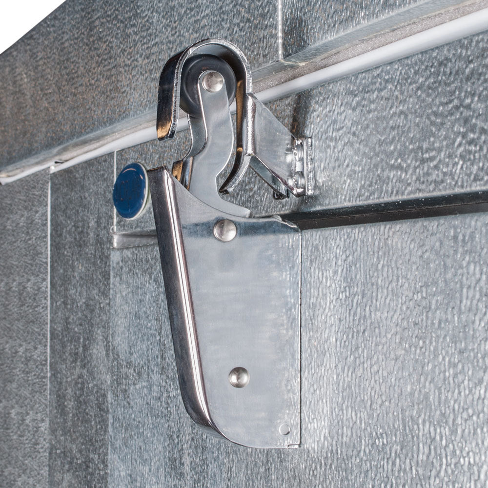 Norlake FTB84814-CX-M Fast Trak 8' x 14' x 8' 4" Floorless Indoor Walk-In Cooler — supplier gallery view 8; A metal hook attached to a metal door with a blue circle on it.