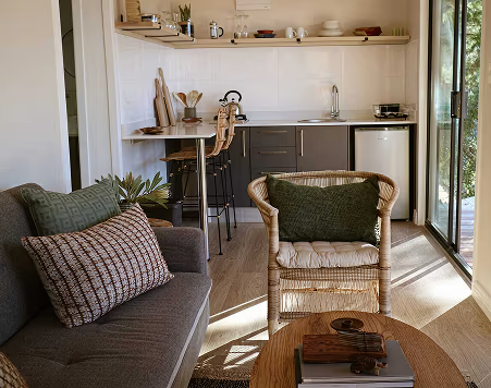 The Studio — Double 6m Container Home with Roof, Deck & Foundations — supplier gallery view 3; The Studio's kitchen and lounge, finished and furnished