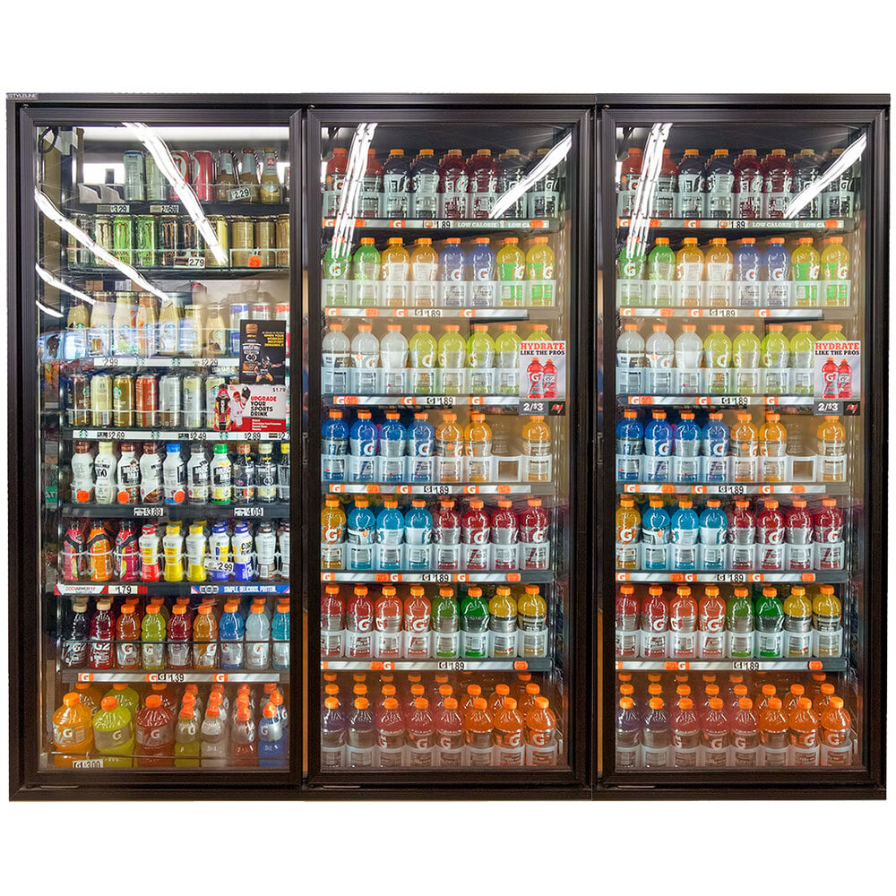 Styleline RM3075-LT Walk-In Merchandiser Doors with Shelving — supplier gallery view 2; A Styleline walk-in freezer merchandiser door with shelving holding a display case of drinks.