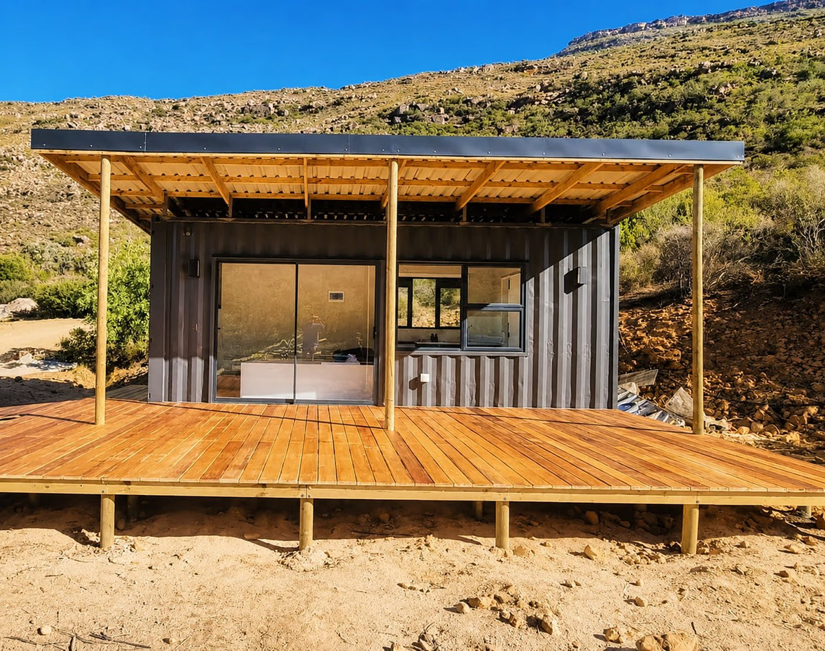 The Tiny — 6m High Cube Studio Home with Roof, Deck & Foundations — supplier gallery view 2; The Tiny built and delivered on a mountain site, with its roof structure and pine deck