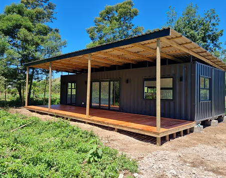 The Independent — Two-Bedroom Double 12m Container Home — supplier gallery view 2; The Independent built and delivered, with its full roof structure and pine deck